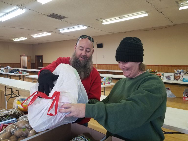 Photo by L. ParsonsBill (left) and Bridget (right) Bagley of the Winslow Elks Lodge No. 536 helped fill and deliver boxes.
