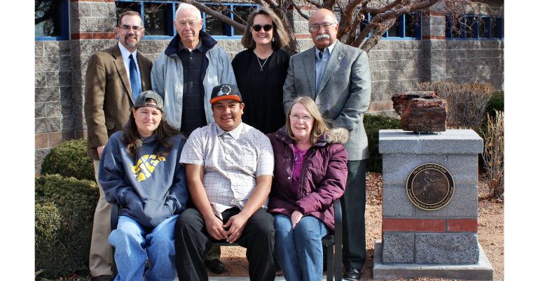 Photo by Toni GibbonsA monument to Dr. Jon Graff for his support of Northland Pioneer College students was recently dedicated and placed at the Nizhoni Learning Center at the Painted Desert Campus in Holbrook. Pictured are (front row, left to right) students Brooke Alexander, Vaughn Willeto and Cynthia Owen, (back row) NPC President Mark Vest, Board Member James Matteson, NPC Friends & Family Executive Director Betsyann Wilson, and Board Member Frank Lucero.