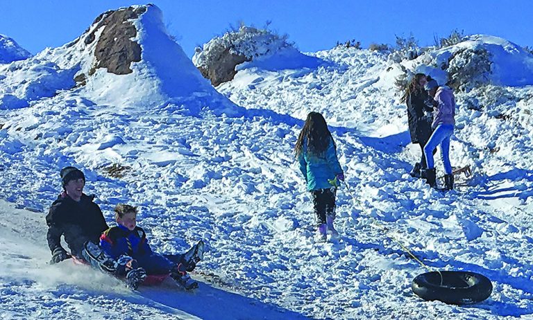Photo by Matthew BargerNortheastern Arizona welcomed in the New Year with heavy snowfall and below zero temperatures but that didn’t deter those who saw it as an opportunity to have some fun like Jonathan and Alexander Dawson who took advantage of the weather to enjoy sledding in Holbrook.