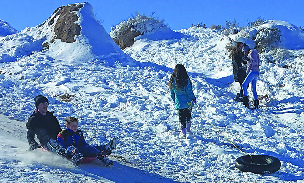 Photo by Matthew BargerNortheastern Arizona welcomed in the New Year with heavy snowfall and below zero temperatures but that didn’t deter those who saw it as an opportunity to have some fun like Jonathan and Alexander Dawson who took advantage of the weather to enjoy sledding in Holbrook.
