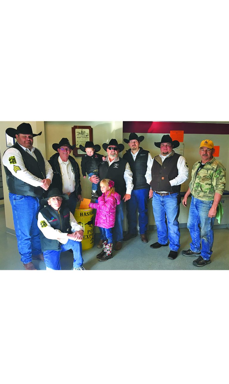 Photo by Matthew BargerIt’s time to get letters ready for the Hashknife Pony Express! Post offices in Holbrook, Winslow, Snowflake, Joseph City, Heber and Overgaard, as well as the Navajo County Historic Courthouse in Holbrook, have a barrel placed in the lobby for depositing letters that will be stamped with a special cachet for the ride. Hashknife riders and a couple of young helpers pictured here at the Holbrook Post Office include (front row, left to right) Phil Cobb, Kashlie Bielefeldt, Sgt. Steve Thomas, Jerry Young, Captain Mark Reynolds holding Crawford Bielefeldt, Chris Baker, Gary Hayes Jr. and Chairman Swing Boss Tim Kelley. The Hashknife Pony Express will take off from Holbrook on Wednesday, Feb. 6.