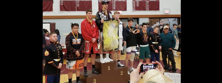 Photo courtesy of Tess DunsmoreWinslow Bulldog Michael Dunsmore (center) was the lone local champion Jan. 18-19 at the Doc Wright Invitational Wrestling Meet in the 170 lb. class.
