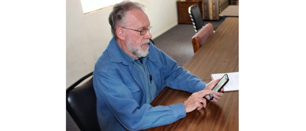 Photo by Toni GibbonsJoe Voutour (pictured) of Snowflake and ambassador with the Snowflake-Taylor Chamber of Commerce and tech-savvy businessman, shows off the simple app on his smartphone that businesses can use to more easily collect Google reviews.