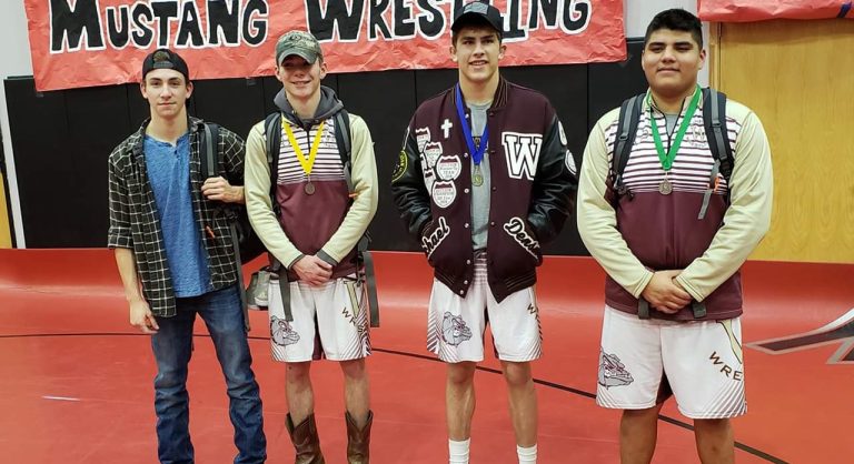 Photo courtesy of Tess DensmoreWinslow wrestlers who placed at the tournament included (left to right) Max Lugo, the 120 lb. champion. Chris Curnutte, who placed fourth in the 132 lb. class; Michael Densmore, the 182 lb. champion and Outstanding Wrestler; and Seth Hernandez, who placed fifth in the 220 lb. class.