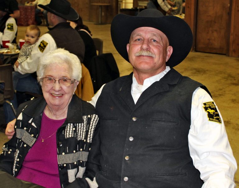 Photo by Toni GibbonsNelda Brinkerhoff (left) sits next to Pony Express Rider Scott Self (right) as she shares how her late husband, Grant Brinkerhoff and her father, Harvey Randall, were charter riders in the very first Hashknife Pony Express ride in 1958.