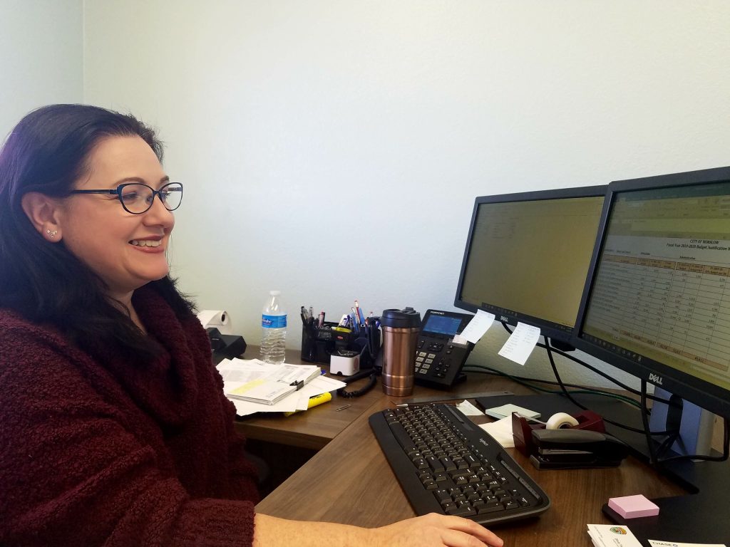 Photo by L. ParsonsCity of Winslow budget analyst Olivia Todd studies reconciliation documents for the city’s finance department.