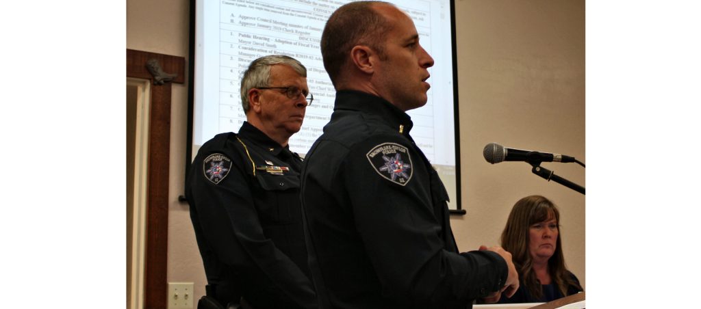 Photo by Toni GibbonsSnowflake-Taylor Police Chief Larry Scarber (left) along with Lieutenant Robert Martin (center) shared with the Taylor Town Council the advantages of combining emergency dispatch services with the Show Low Police Department at the Feb. 12 special meeting. Also pictured is Town Clerk Geri Judd (right).