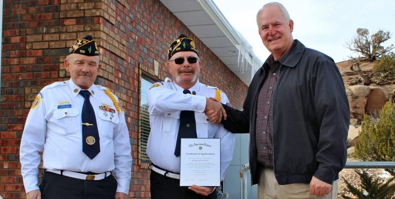 Photo by Toni GibbonsOn Feb. 26, American Legion Post 126 Sergeant-In-Arms Randall Welch (left) and Commander Gary Trickett (center) gave Kirk Brimhall (right), general manager of Brimhall Sand, Rock & Building Materials a plaque in appreciation for the gift of 20 tons of gravel for the parking area around the Legion’s building.