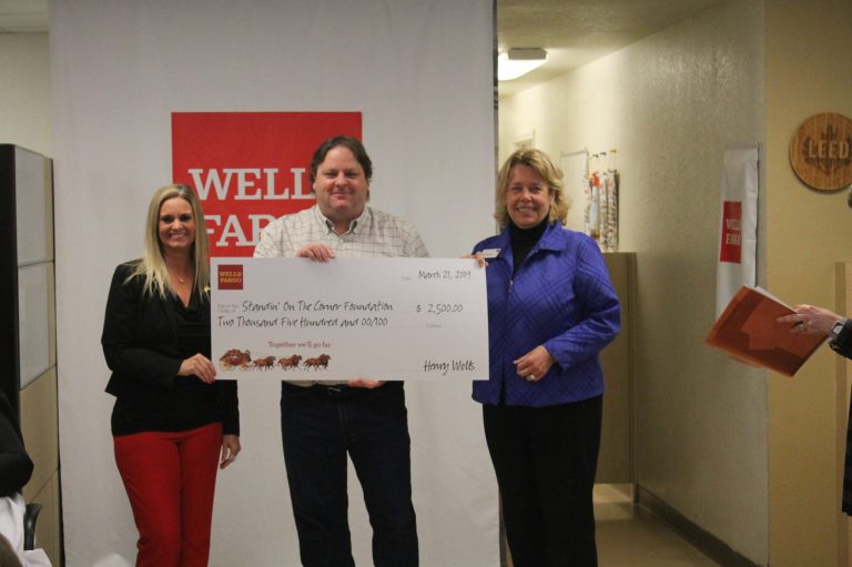 Photo by Linda KorWells Fargo representatives presented the Standin’ On The Corner Foundation in Winslow with a $2,500 check on March 21 that was accepted by Tommy Butler (center) who is with the foundation.
