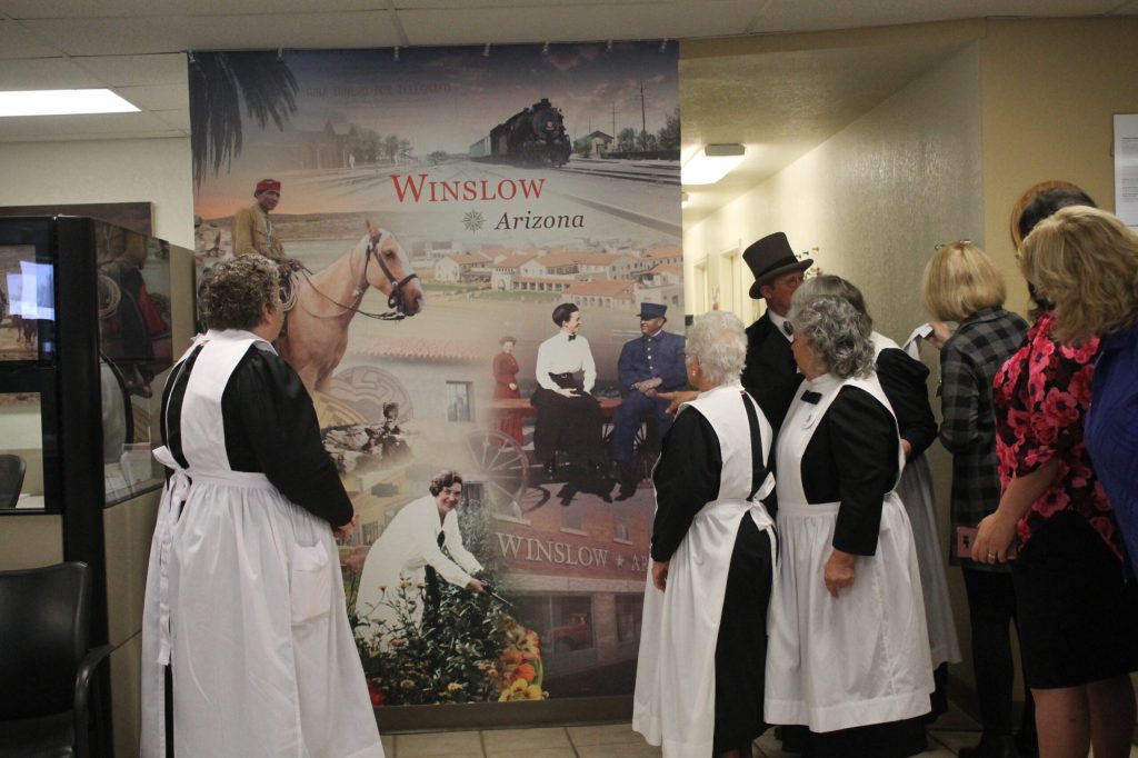 Photo by Linda KorThe Harvey Girls show admiration for the mural now on display at the Winslow Wells Fargo Bank branch.