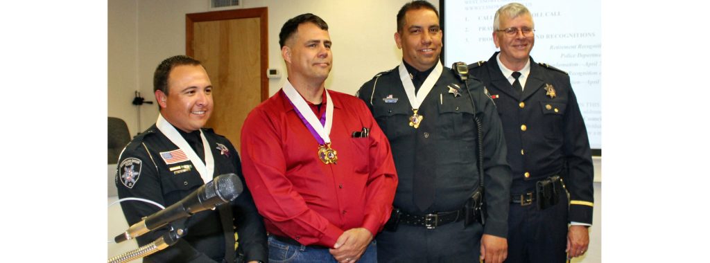 Photo by Toni GibbonsAt the Snowflake Town Council April 2 meeting Snowflake-Taylor Police Chief Larry Scarber (right) awarded (left to right) Officer Monseis Ramos the department’s Life Saving Award for their heroic and life-saving efforts while serving the community, Sergeant Daniel Rusk Sr., the department’s Purple Heart and Life Saving Award; and Sergeant Derick Ortiz, the department’s Life Saving Award.