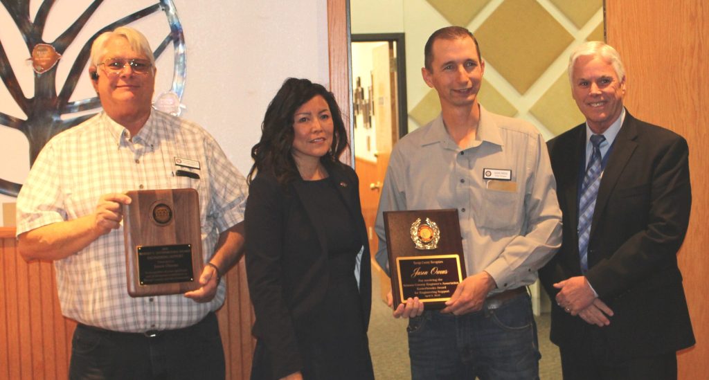 Photo by Toni GibbonsNavajo County Engineer Project Manager Jason Owens (second from right) was recognized at the Board of Supervisors meeting for receiving the Arizona County Engineer’s Association Esterbrooks Award for Engineering Support in 2018. Also pictured are (left to right) County Engineer Bill Bess, Chairwoman Dawnafe Whitesinger and Public Works Director John Osgood.