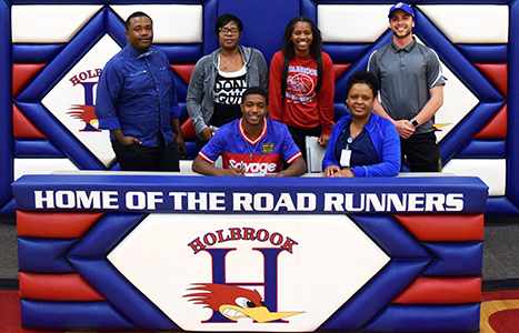 Photo courtesy of Holbrook High SchoolHolbrook High School senior Jeff Jones (seated center) was surrounded by his family and coach on April 25 while signing a National Letter of Intent to participate in track and field at Pima Community College in Tucson. Jeff will also participate in the 2019 State Track Meet on May 3 and 4 at Mesa Community College competing in the long and triple jump. He is the returning state champion in both events.