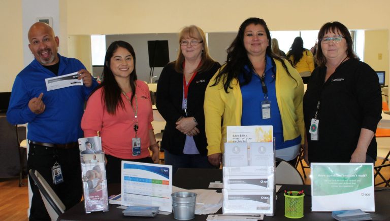 Photo by Toni GibbonsArizona Public Service (APS) staff members set up shop at the Machusak Recreational Center in Holbrook on April 24 to educate customers, especially those in need, about the assistance programs and energy-saving options available through APS. Pictured are (left to right) Team Lead John Ruiz, call center advisors Maria Lopez, Prisicilla Brockman and Marissa Morales, and Community Affairs Manager Janet Dean.