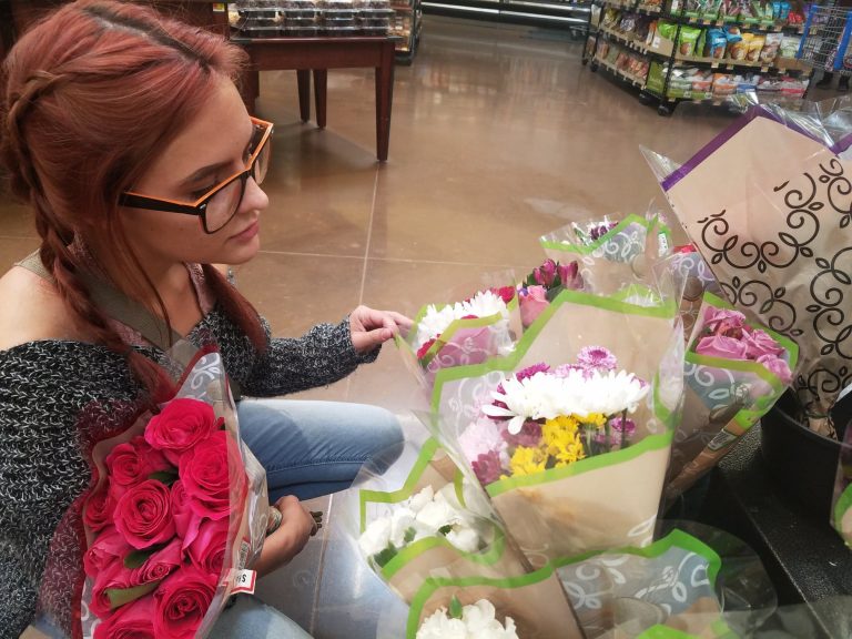 Photo by L. ParsonsDelphi Lander (pictured), on a visit home to Winslow, looks to pick the perfect bouquet at her local Walmart to honor her mother for Mother’s Day this Sunday, May 12.