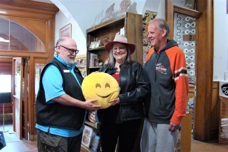 Photo courtesy of Navajo County Historical SocietyApril was Happy Holbrook Month and the Holbrook Visitors Center and Museum shared the event with Scot and Jennifer Stuerke of Kansas City, Mo. The couple stopped in Holbrook on their way home from a vacation to take in the Petrified Forest National Park and sections of Route 66. Presenting them with a Happy pillow for their vehicle is Navajo County Historical Society Staff Member Gene Dixon (left).