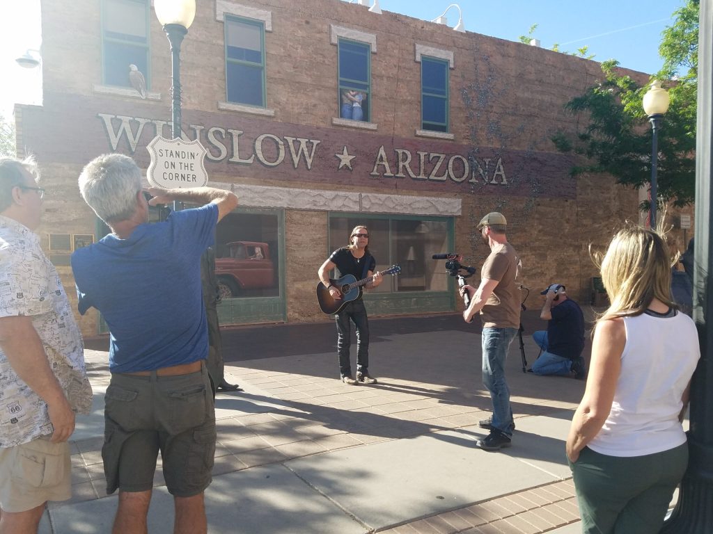 Photo by L. ParsonsWinslow tourism in in full swing with people vying for photos, or in this case a video in front of the famous statues at the Standin’ on the Corner Park.