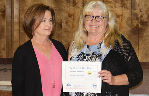 Photos by Toni GibbonsHolbrook Junior High School Principal Dr. Jeri McKinnon (left) presents HJHS special education teacher Linda McMahon (right), with the HJHS Teacher of the Year Award at the Holbrook Elks Youth Awards Banquet on May 6.