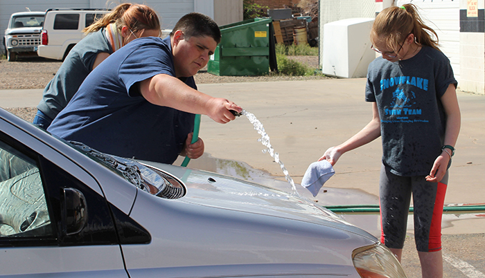 Photo by Toni GibbonsStudents from Snowflake High School, both with and without disabilities, participated in a car wash and bake sale fund raiser for Special Olympics Unified on April 26 at Black Diamond Auto Glass in Taylor.
