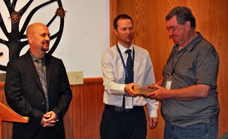 Photo by Toni GibbonsNavajo County Health Director Jeff Lee (left) with Human Resource Director Eric Scott (center) made a presentation to retiring employee Jeffrey Nafziger (right) for nearly 15 years of service as an inspector with the Navajo County Health Department at the Board of Supervisors meeting on May 14.