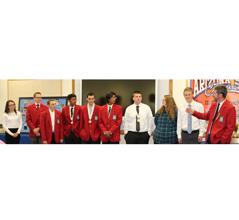 Photo by Toni GibbonsSnowflake High School Construction Technology Teacher Daniel Prestwich (far right) introduced the SHS SkillsUSA championship teams that will be travelling to Louisville, Kent., for the national competition at the end of June to the Snowflake Unified School District Governing Board at the meeting on May 9. Pictured are (left to right) Paulina Loya, Ryan Miller, Austin Reynolds, Wyatt Dokey, Anthony Gabaldon, William Dokey, Derrick Willis, Kathy Peterson and Tyler Peterson.