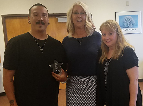 Photo by L. ParsonsThe WUSD Governing Board and Superintendent Cyndie Mattox (center) recognized music teacher Ginger Fischer (right) as the classified employee of the month and transportation employee Tony Mora (right) as certified employee of the month.