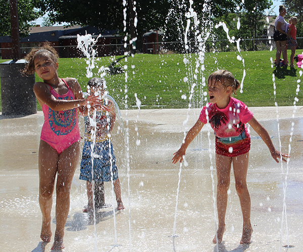 Photo by Toni GibbonsThe Splash Pad at Pioneer Park in Snowflake is the cool place for kids all around the White Mountains, as Show Low residents Addison Palmer (left) and Paisley Lowe (right) showed as they played in the fountains of water.