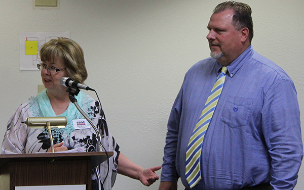 Photo by Toni GibbonsTracy Mancuso (left), Small Business Development Center director with Northland Pioneer College, introduced Robert Theobold (right), ombudsman for the Arizona Commerce Authority to the Navajo County Community College District Governing Board at the meeting on June 18.