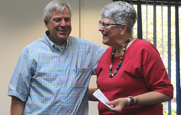 Photo by Toni GibbonsKenny Keith, (left) faculty in Energy and Industrial Technician took it in stride when Dr. Inez Schaechterle, (right) faculty in English, presented with a drawing of snake doodle as his emeritus since his actual award hadn’t been delivered in time for the meeting.