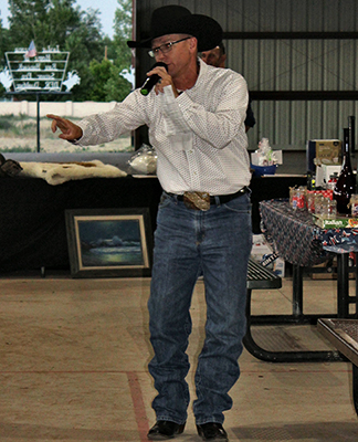 Photo by Toni GibbonsAuctioneer Dan Turley created some hot bidding wars on some items at the Snowflake-Taylor Chamber of Commerce Annual Dinner and Auction on June 21.