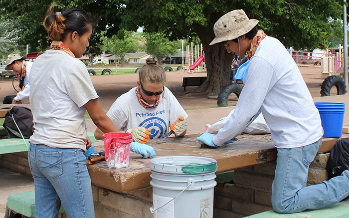 Photo by Toni GibbonsKids from the Petrified Forest National Park Youth Conservation Corp, spent June 26 helping to scrape and repaint the picnic tables at Holbrook’s Hunt Park as part of beautification partnership that the park has with the city. Pictured are (left to right) Levina Rogers, Kellie King and Samuel Laughter.
