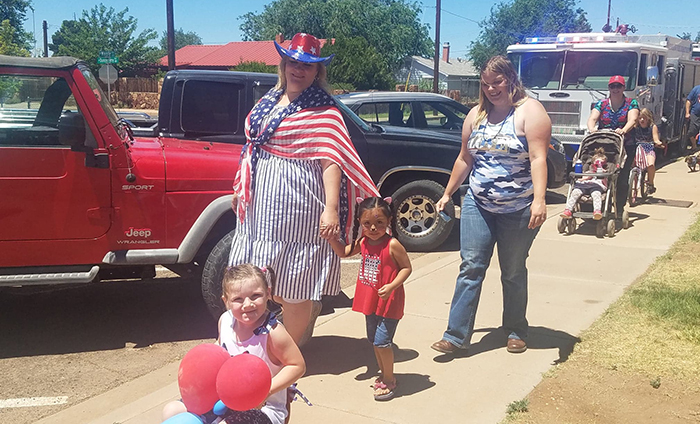 Photos by L. ParsonsThe annual Freedom Fun Festival was held on the Fourth of July in Winslow. Sadie Gose (right) followed by her cousins and her mother, Tabatha Ferrel (left), participated in the children’s patriotic parade.