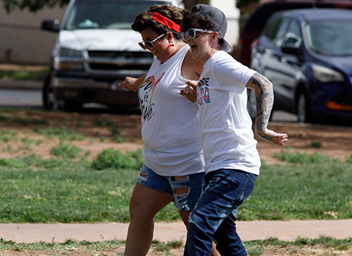 Jillian Stotts (right) and Chea Cavin (left) won the three-legged race at the family barbecue during Winslow’s Pride event.