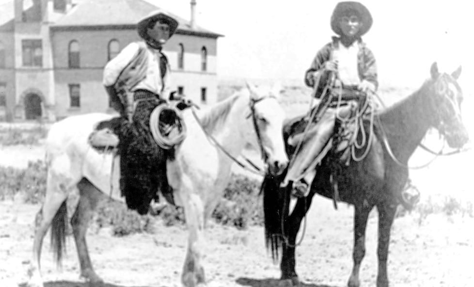 Tribune News archivesThe Navajo County Historic Courthouse today looks very much like it did when originally built in 1898, which is approximately when this photo was taken with the cowboys in the foreground. The original roof is still on the building with asbestos shingles layered over the top in 1929. The effort is now underway to replace the roof in order to preserve the historic structure and its contents.