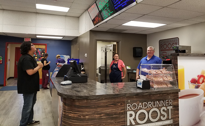 Photo by China CassidySean Nez (left) considers his choices carefully at the Roadrunner Roost while Crystal Hubbard (middle) and Ray McLaws (right) wait to take his order.