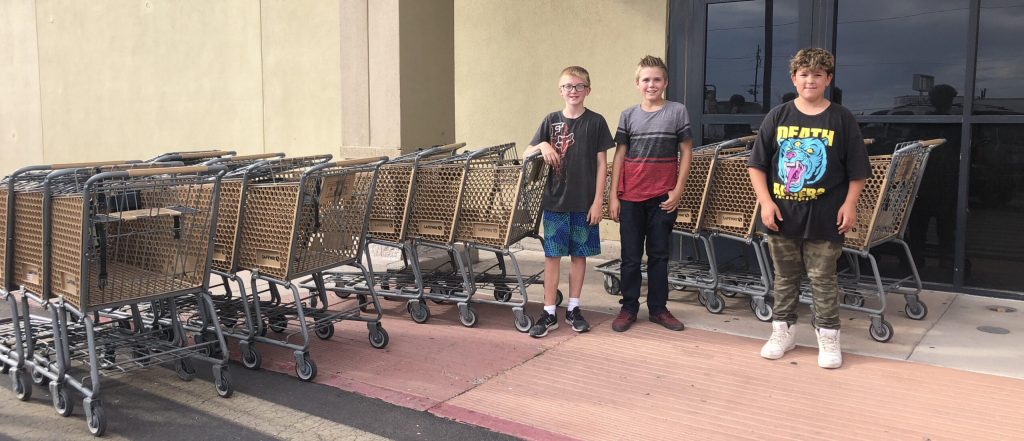 Photo by Nicole YoungHolbrook seventh graders Brayden Bolton, Jesse Polzin and Isaiah Padilla took it upon themselves to do a neighborhood clean-up last week. These community leaders in the making gathered a total of 14 Safeway shopping carts from the neighborhoods around the store and returned them.