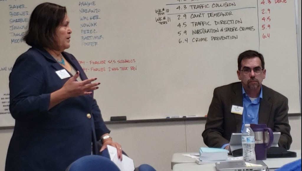 Photo by Amanda NicholsPresident Mark Vest (right) listens to Vice President of Administrative Services Maderia Ellison (left) as she informs the District Governing Board of issues with employees’ compensation.