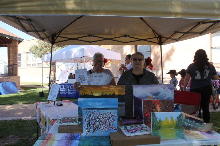 Photos by China CassidyLocal author Bea Darbe (left) and artist Sue Dixson (right) showcase their work on the front lawn of the Historic Navajo County Courthouse during Old West Fest.