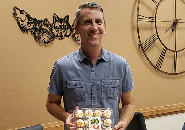 Photo by Amanda NicholsIt was a sweet surprise for board member Shea Flake who received a birthday treat from Administrative Assistant Tohna Rogers after the business of the meeting was over.