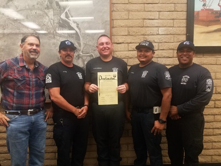 Photo by L. ParsonsMayor Tom McCauley (left) presented members of the Winslow Fire Department (left to right), Dustin Cole, Michael Lawrence, Derek Begay and Nolan Horn with a proclamation declaring the week of Oct. 6-12 as Fire Prevention Week in Winslow.