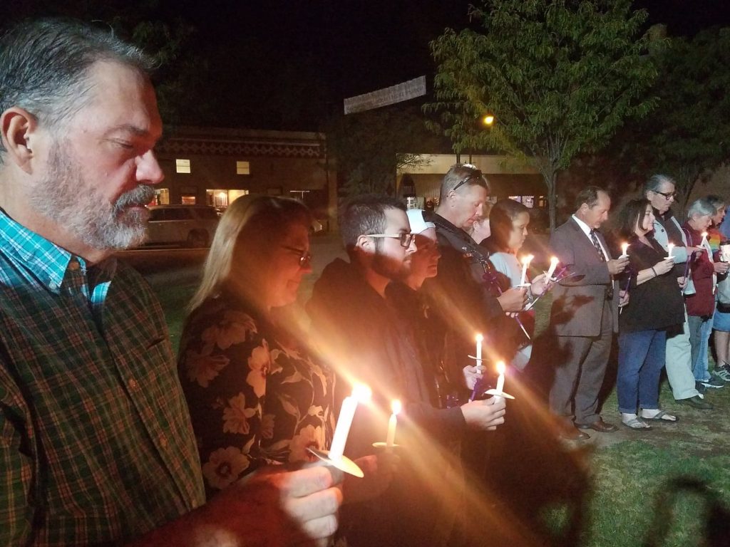 Photo by L. ParsonsWinslow Mayor Tom McCauley (left) was among approximately 30 people that attended the Alice’s Place Candlelight Vigil for domestic violence awareness.