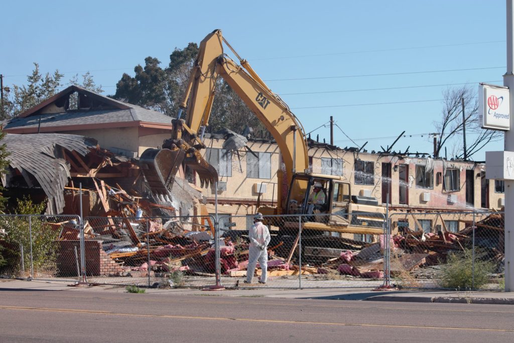 Photo by China CassidyAfter more than a year, the Magnuson Hotel on Hopi Drive in Holbrook is finally coming down. The two-story, 54-room hotel was consumed by fire in 2018 after transients in a trailer next to the hotel set the structure on fire and it jumped to the hotel. The massive eyesore will be leveled to the ground with future plans for the lot not yet addressed.