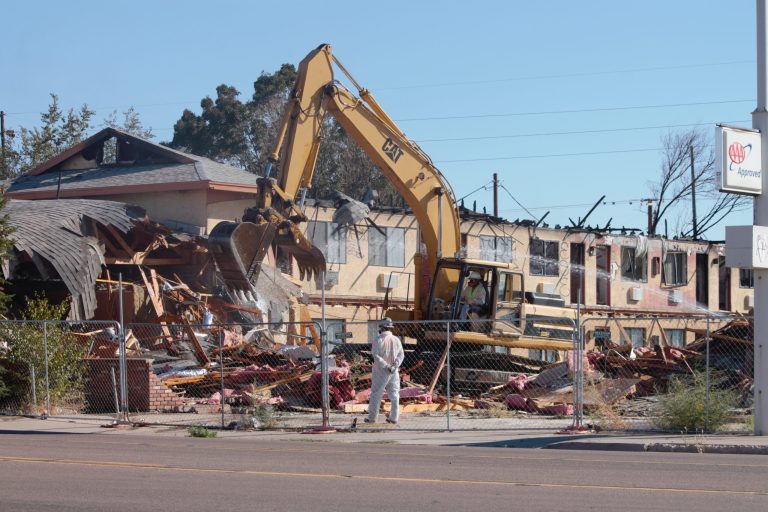 Photo by China CassidyAfter more than a year, the Magnuson Hotel on Hopi Drive in Holbrook is finally coming down. The two-story, 54-room hotel was consumed by fire in 2018 after transients in a trailer next to the hotel set the structure on fire and it jumped to the hotel. The massive eyesore will be leveled to the ground with future plans for the lot not yet addressed.