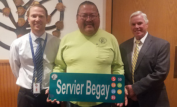 Photo by L. ParsonsNavajo County Human Resources Director Eric Scott (left) and Public Works Director John Osgood (right) presented Servier Begay (center) with a token of appreciation for 35 years of service to the county.