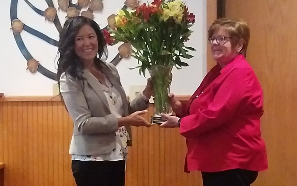 Photo by L. ParsonsNavajo County Board of Supervisors Chairwoman Dawnafe Whitesinger (left) presents Treasurer Debra Kester (right) with congratulatory gift upon her retirement after 34 years of service to Navajo County.