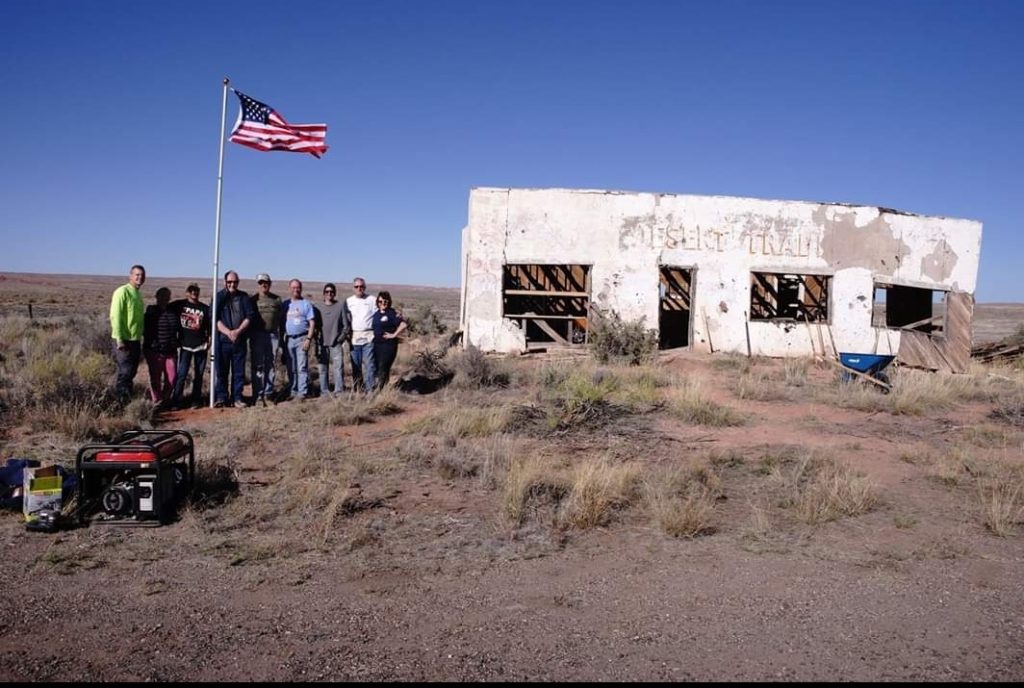 Photo Courtesy of Rich DinkelaIn March of 2018, members of the Route 66 Co-Op and volunteers (left to right) Rich Dinkela, Kristy Snow, Brian Ross, Mike Ward, Jerry Homes, Richard Walker, Jamie Jessop, Jim Ross and Shelley Graham started the first phase of the restoration project of the Painted Desert Trading post. The second photo shows what the structure looks like today.