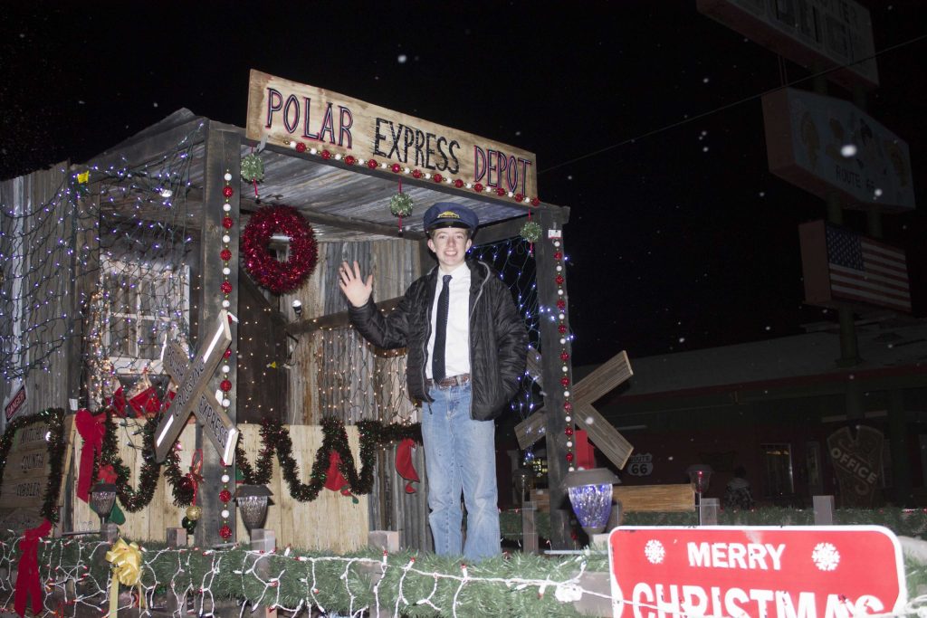 Photo by Linda KorHundreds gathered to watch and take part in the annual Holbrook Parade of Lights last Saturday. Arizona Public Service once again impressed, with their float themed Polar Express with a young conductor welcoming passengers to come aboard.