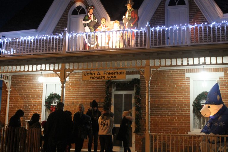 Photos by Amanda NicholsLocals wait in line at the John A. Freeman Pioneer Home on Main Street to see Santa Claus and tell him their Christmas wishes and receive goodie bags at the Snowflake Town Lighting.