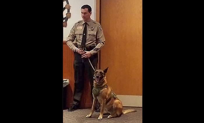 Photo by L. ParsonsSheriff’s Deputy Danny Deets with retiring K-9 Deputy Legend.