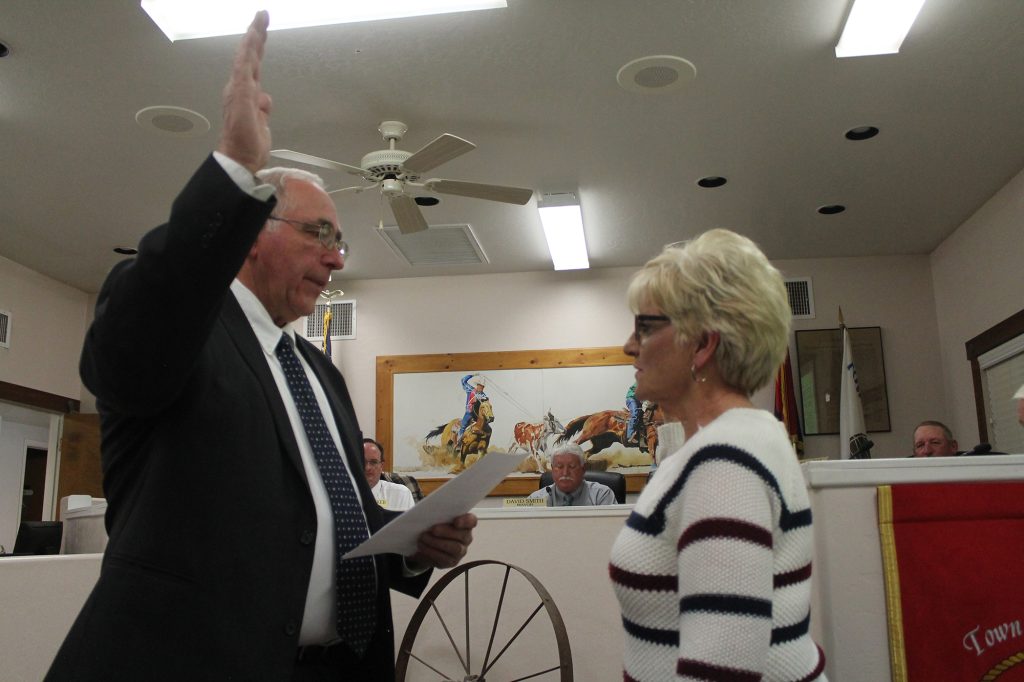 Photo by Amanda NicholsSherry Cosper (right) gets sworn in by Snowflake Justice Court Judge Fred Peterson (left) after a successful nomination to the empty spot on the Taylor Town Council at the Jan. 9 meeting.